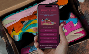 Phone tapping xentag on a pair of sneakers.