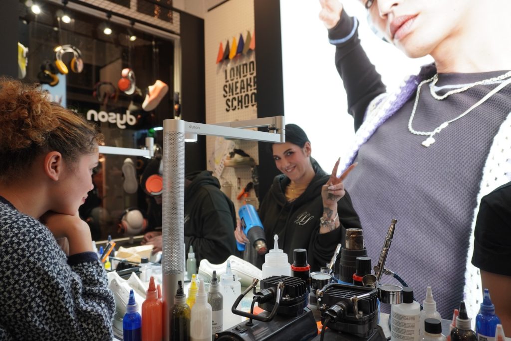 Influencer Watching Sneaker Customization in Real-Time